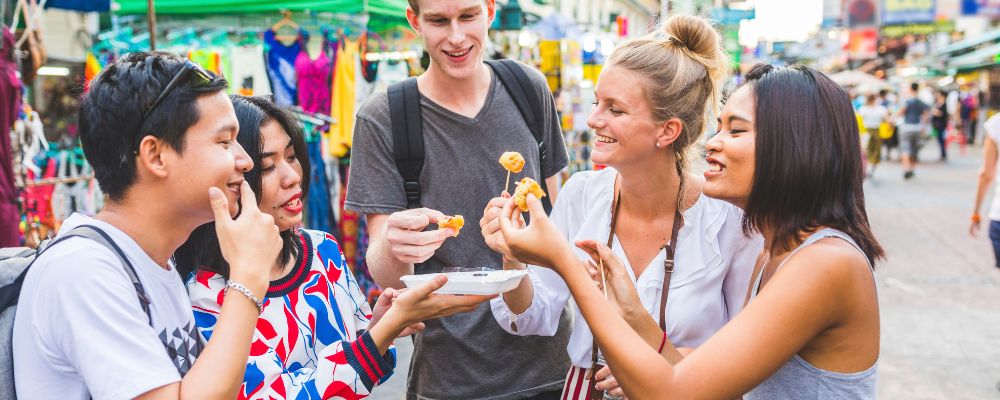 Friends eating street food